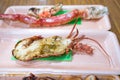 Focus and close up to grilled shrimp in Foam plate on the wood table Royalty Free Stock Photo