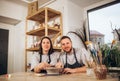 Focus couple potter working on potters wheel making ceramic pot from clay in pottery workshop. Couple in love working Royalty Free Stock Photo