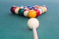 Focus on cue aiming white ball to break snooker billards Royalty Free Stock Photo