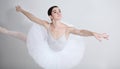 Focus, dance and ballet with a woman in studio on a white background for rehearsal or recital for theatre performance