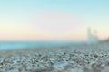 Focus Detail on Morning light stones on beach close to the shore Royalty Free Stock Photo