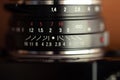 Focus dial of a vintage manual lens Royalty Free Stock Photo