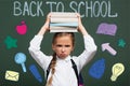 Focus of displeased schoolgirl holding books