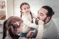 Focus on father having his beard comed by his cute children Royalty Free Stock Photo