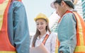 Focus on female engineer looking at paper for project planning Royalty Free Stock Photo