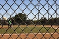 Focus on the fences with background Baseball field out of focus Royalty Free Stock Photo