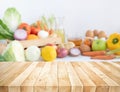 Focus on foreground.wood table with blur variety vegetable with copy space. Healthy eating with vegetarian concepts