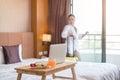 Focus on fruit. An Asian businesswoman Pack your luggage for travel in your hotel room
