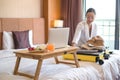 Focus on fruit. An Asian businesswoman Pack your luggage for travel in your hotel room