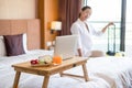 Focus on fruit. An Asian businesswoman Pack your luggage for travel in your hotel room