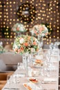 Focus on glasses. Banquet table in the restaurant, the preparation before the banquet. the work of professional florists Royalty Free Stock Photo