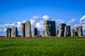 focus on grass with stongehenge blurred background