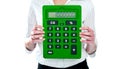 Focus on green calculator. Woman holding