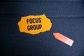 Focus Group white sheet of paper with text. on a red notebook. Royalty Free Stock Photo