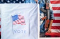 Focus on gun, Concept of US election gun violence, voter fraud and threat at polling station during presidential Royalty Free Stock Photo