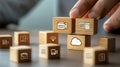 Data Management & Cloud Computing Concept Hand Stacking Wooden Blocks with Folder, Wifi, Mail, Camera, and Cloud Icons