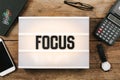 Focus text headline in vintage style light box on office deskt op