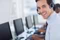 Focus on a joyful call centre agent Royalty Free Stock Photo