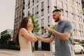 Focus on keys, held by excited young spouses homeowners. Happy married family couple celebrating moving in new house home , Royalty Free Stock Photo