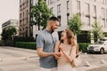 Focus on keys, held by excited young spouses homeowners. Happy married family couple celebrating moving in new house home , Royalty Free Stock Photo