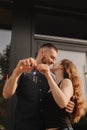 Focus on keys, held by excited young spouses homeowners. Happy married family couple celebrating moving in new house home , Royalty Free Stock Photo