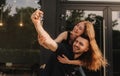 Focus on keys, held by excited young spouses homeowners. Happy married family couple celebrating moving in new house home , Royalty Free Stock Photo