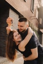 Focus on keys, held by excited young spouses homeowners. Happy married family couple celebrating moving in new house home , Royalty Free Stock Photo