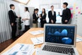 Focus laptop display BI with blurred background of office worker in harmony. Royalty Free Stock Photo