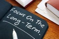 Focus on the long term written on the page Royalty Free Stock Photo