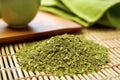 focus on loose leaf green tea on a bamboo mat Royalty Free Stock Photo