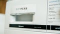 Focus on the Made in Germany inscription on a Siemens washing machine with