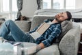 Focus of man with book sleeping on couch at home Royalty Free Stock Photo