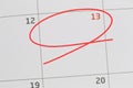 Focus on number 13 in calendar and empty red ellipse.