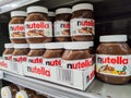 Focus on Nutella jars of hazelnut cream in french supermaket shelf. Nutella is a brand of products made in Italy by Ferrero