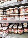 Focus on Nutella jars of hazelnut cream in french supermaket shelf. Nutella is a brand of products made in Italy by Ferrero