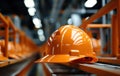 Focus on orange hard hat atop a pipe, construction site photo