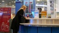 Focus of people exchanging money inside YVR airport