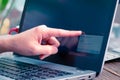 Focus on the point finger touching the laptop screen for inputting the network security key Royalty Free Stock Photo