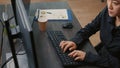 Focus on programer hands typing code on keyboard while looking at computer screen