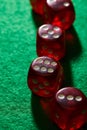 Focus of red dice on green background Royalty Free Stock Photo