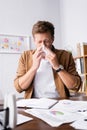 Focus of sick businessman holding napkin Royalty Free Stock Photo