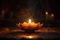 focus on a single glowing diya