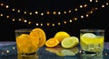 focus at slice fresh orange and lemon in juice glass in front of slice orange Royalty Free Stock Photo