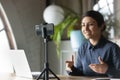 Skilled confident indian woman recording educational business lecture.