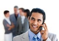 Focus on a smiling businessman on phone Royalty Free Stock Photo