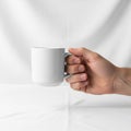 Focus solely on the interaction between the hand and the mug, Royalty Free Stock Photo