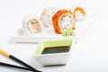 Focus on soy sauce, shushi rolls in back Royalty Free Stock Photo