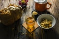 Focus Spot Chrysanthemum Tea and dried chrysanthemum on an old wooden table.