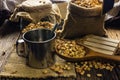 Focus Spot Coffee beans and coffee cup on a wooden table.