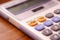 Focus the tax button on the calculator. Concept of calculation and annual tax refund